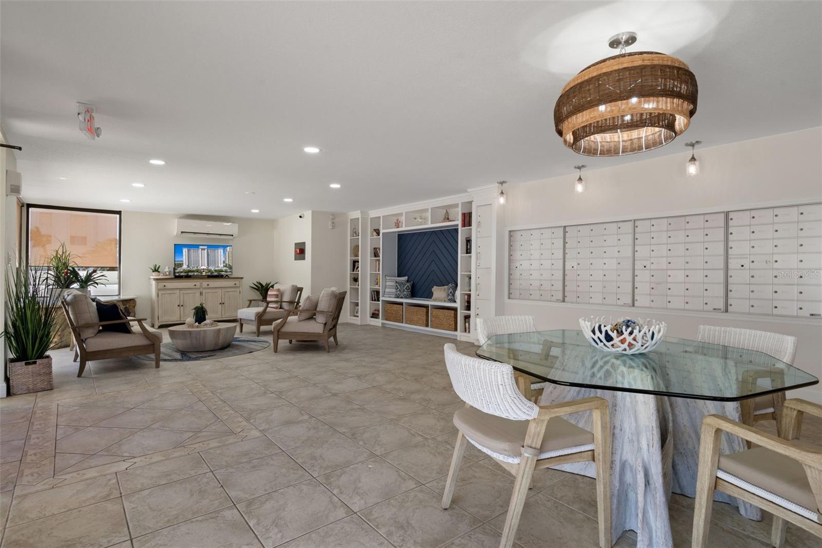 Community Mail Room offers several sitting areas and a TV