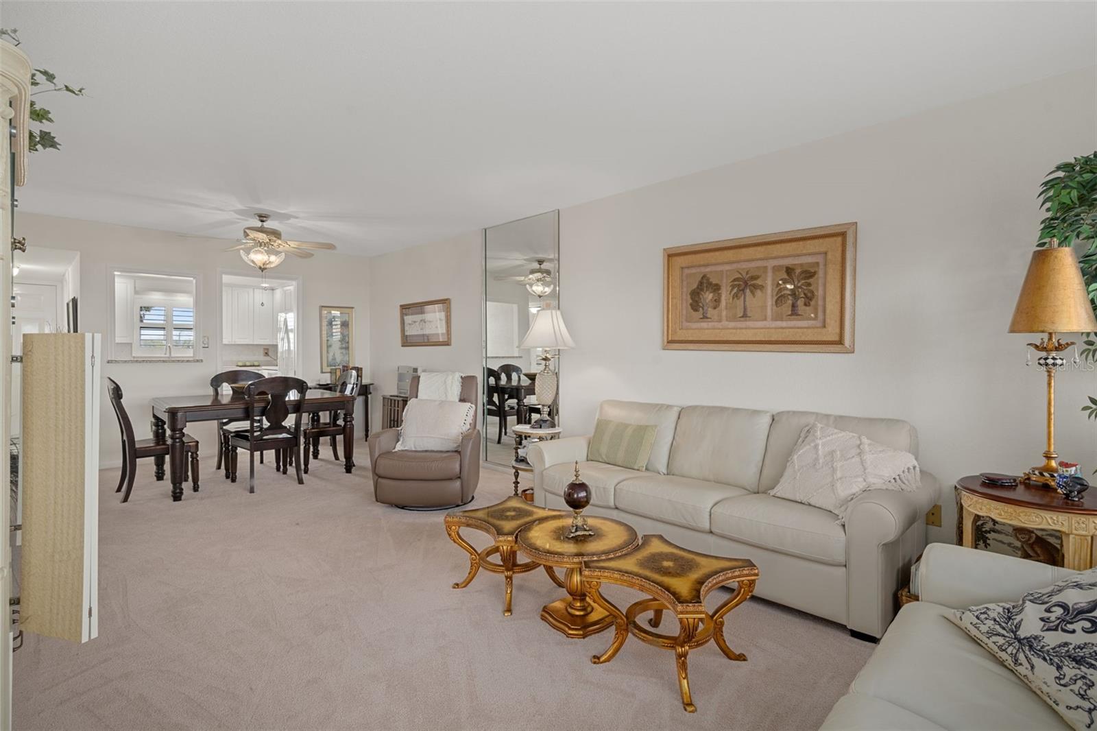 View from living room into dining area and kitchen up front