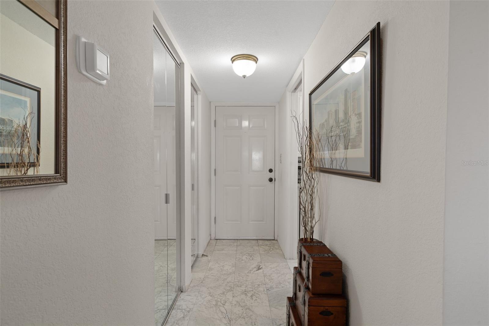Entry foyer with storage closets