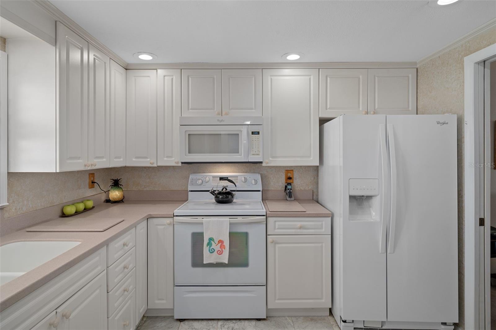 A roomy & bright kitchen with plenty of storage!