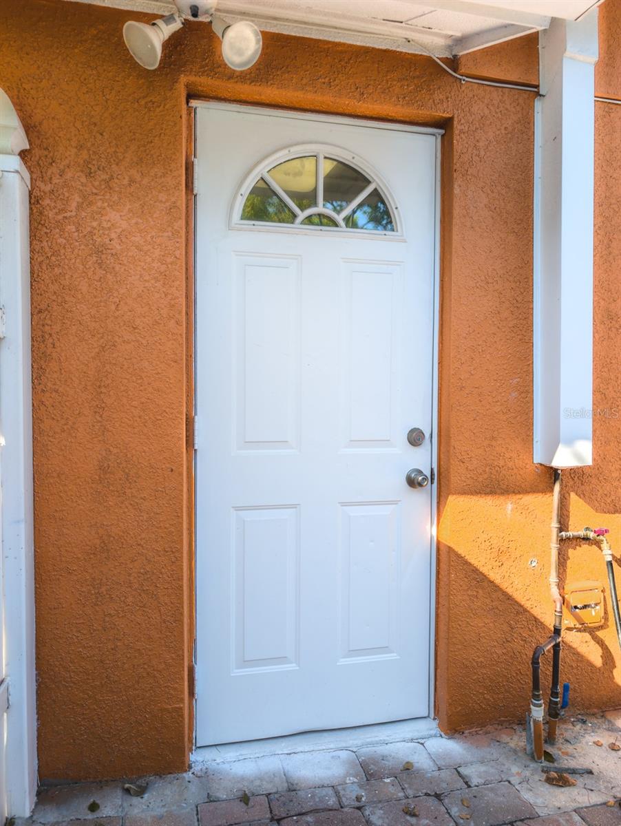 side pavered patio area that could be just for the mother in law suite