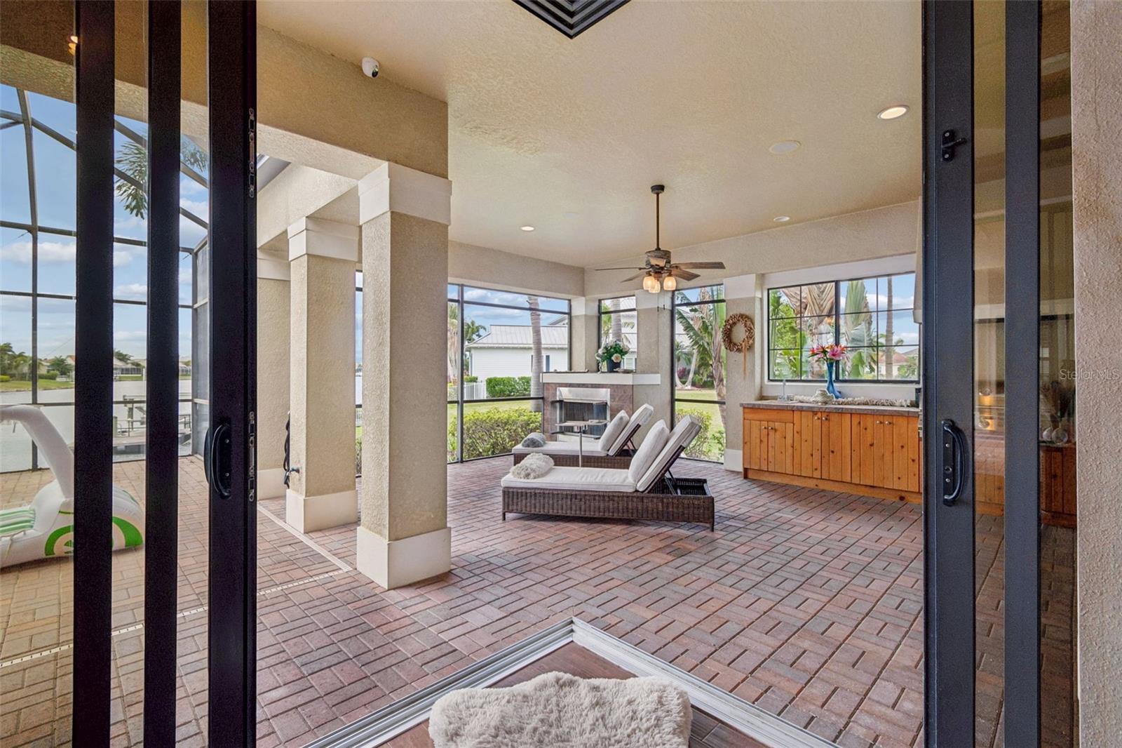 Outdoor Gas Fireplace, Kitchen and Ceiling Fan