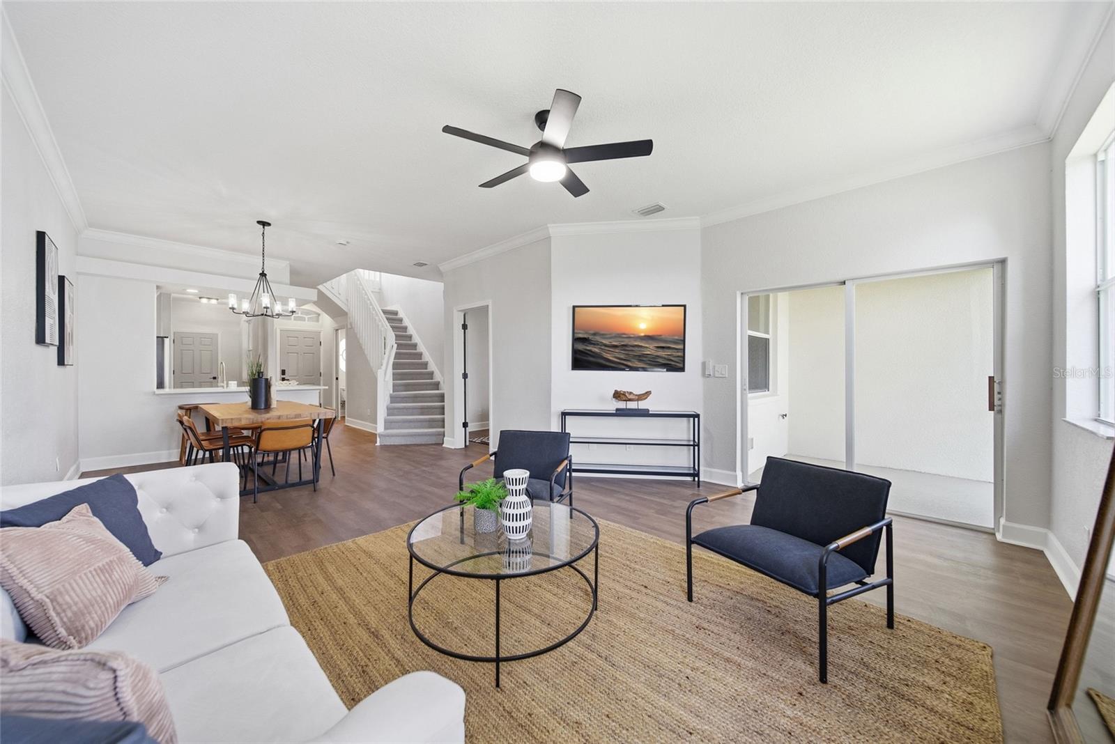 Living Room with view of sliding glass door to patio.