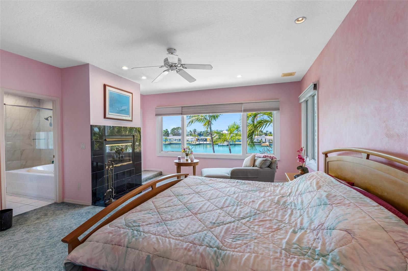 Primary has a wood burning fireplace and great water views.