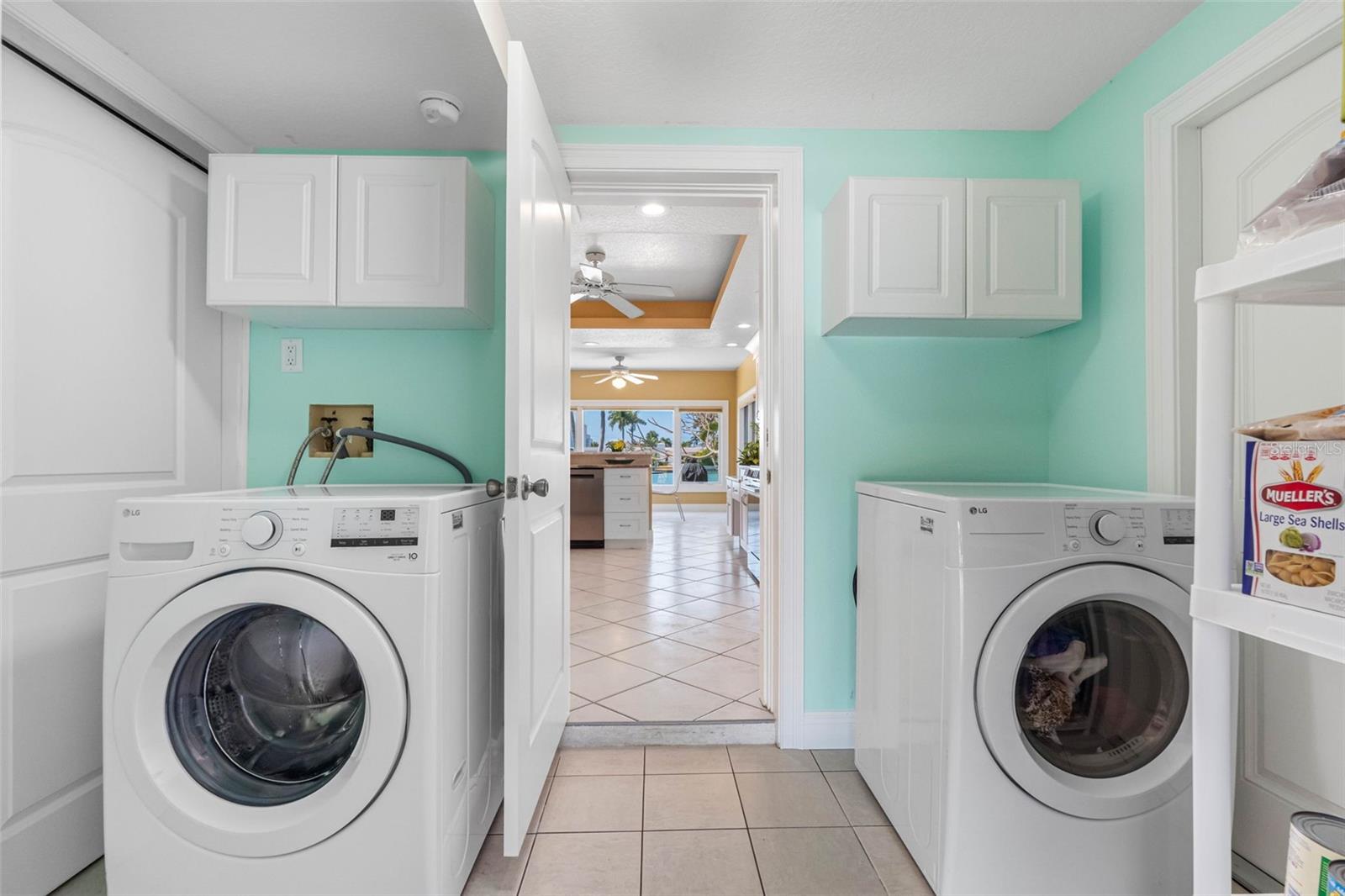 Laundry room is located right off the kitchen.