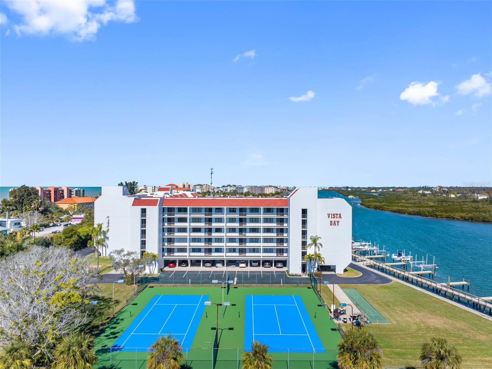 .. Tennis & Pickle Ball Courts are located on the south end of the Complex , thereby affording wonderful winter sun basking the players and spectators.
