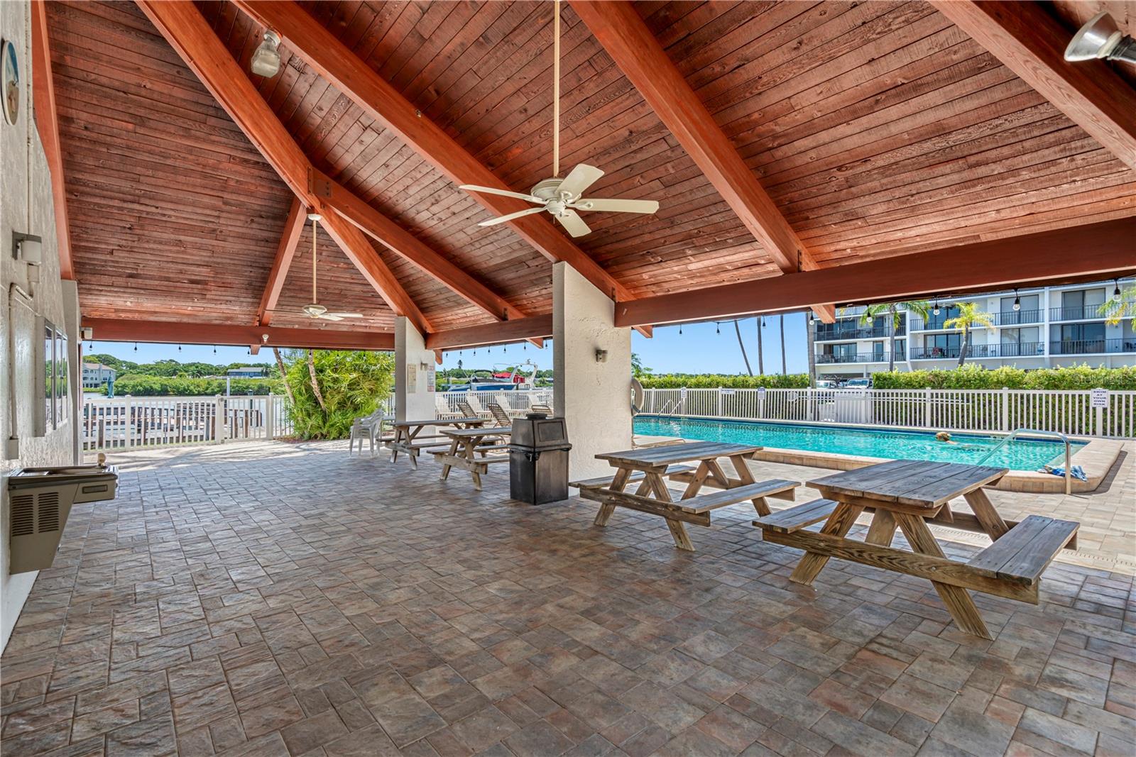 ... Covered Lounging  Area By Heated Pool - Fishing & Day Dock Right out from Pool Area on The New Promenade.