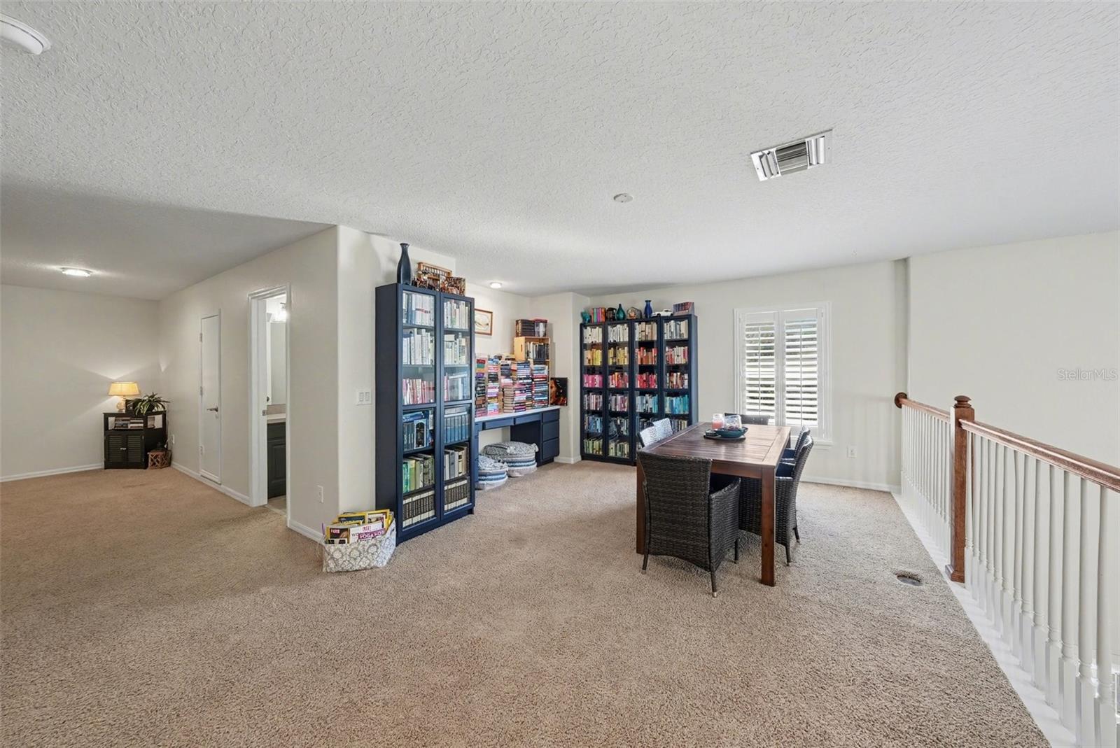 The second floor features a wonderful flex space, two bedrooms with a shared full bath, and attic space.