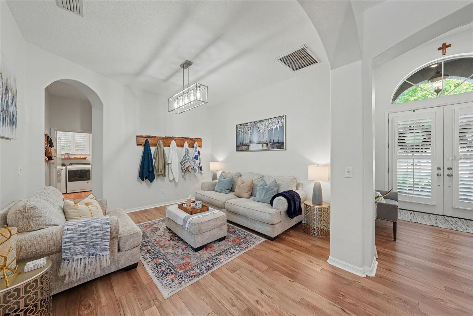 The versatile room offers an inviting room for gathering and entertaining and a peaceful nook for quietly relaxing.