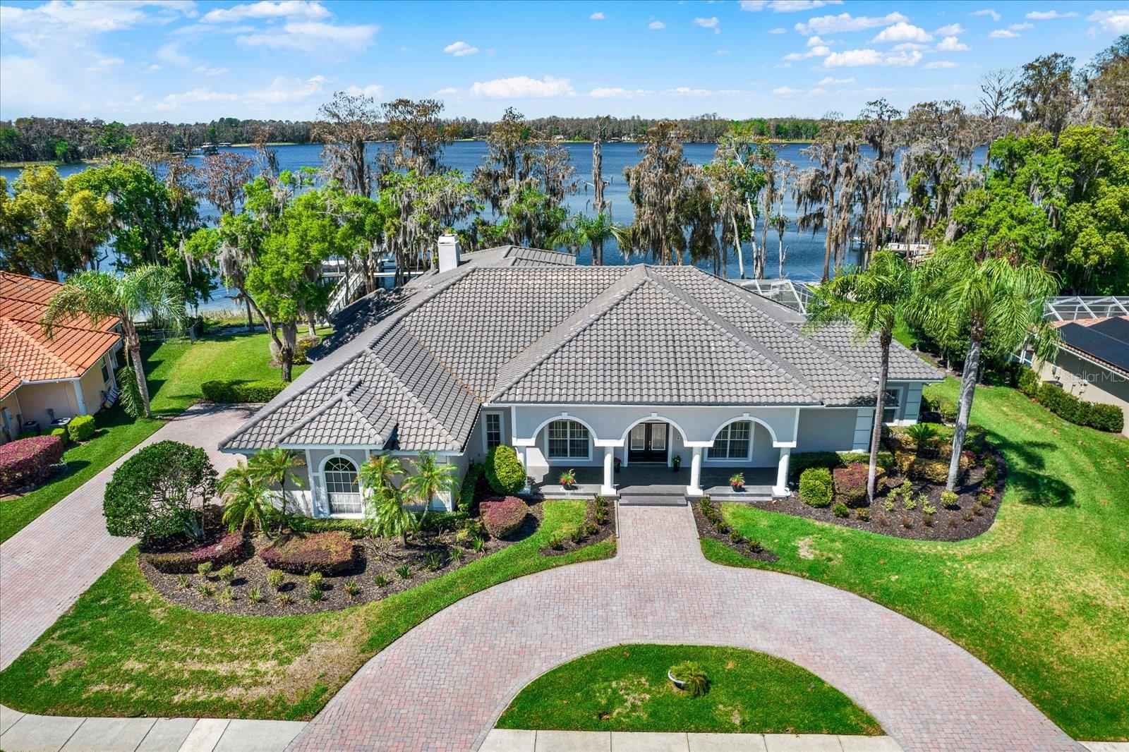 A circular drive to greet all your guests, along with a private drive to the side entry garage.