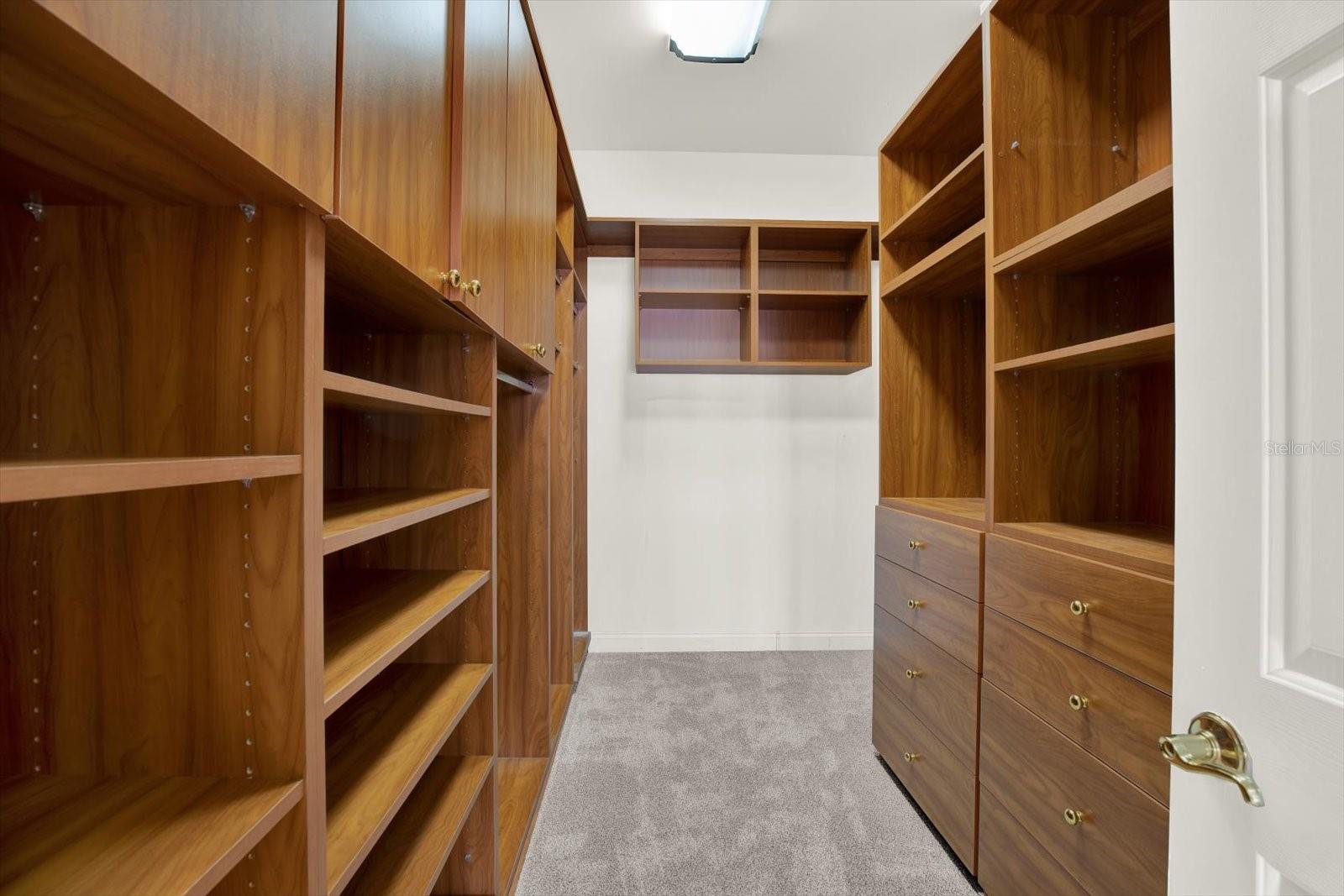 The first of two expansive walk in closets in the primary suite.