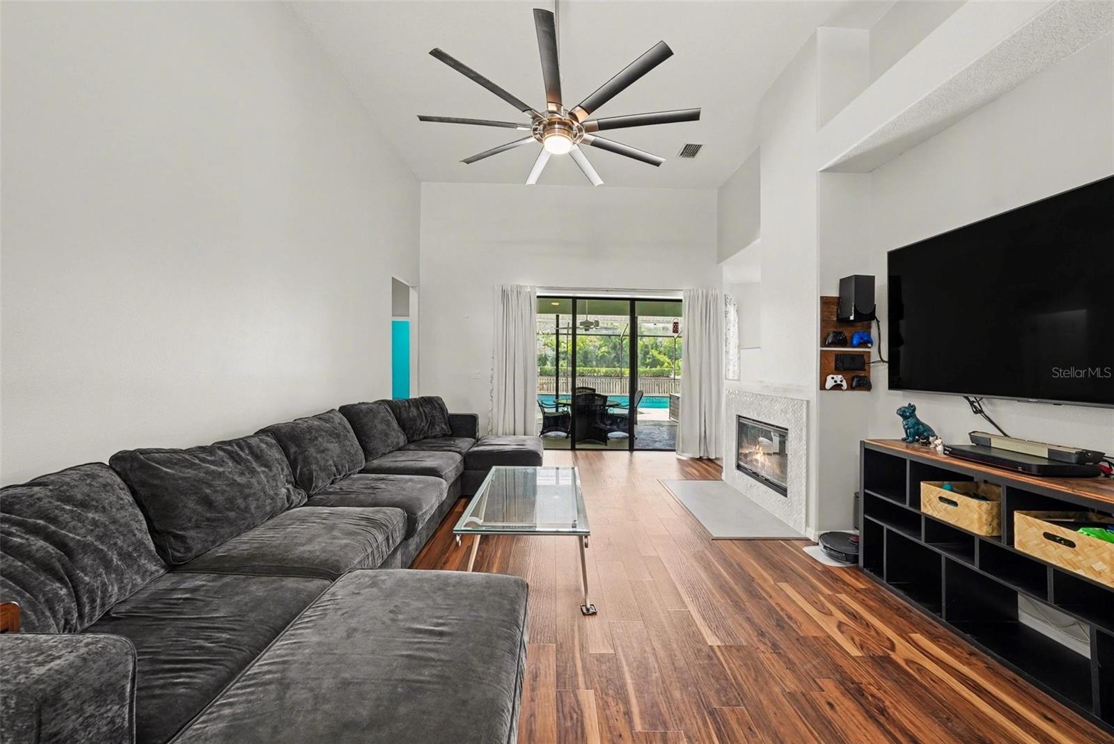 The living area has been recently updated with fresh paint and newly retiled wood-burning fireplace