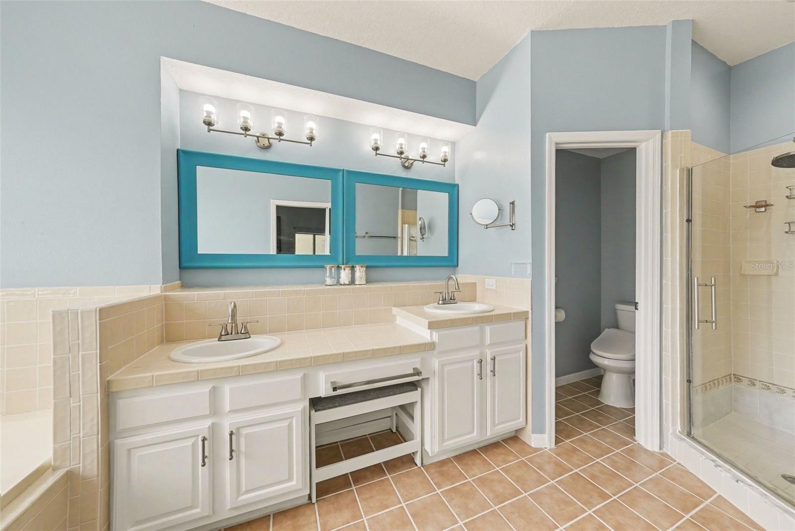 The primary en suite has double sinks, which are a necessity to any married couple