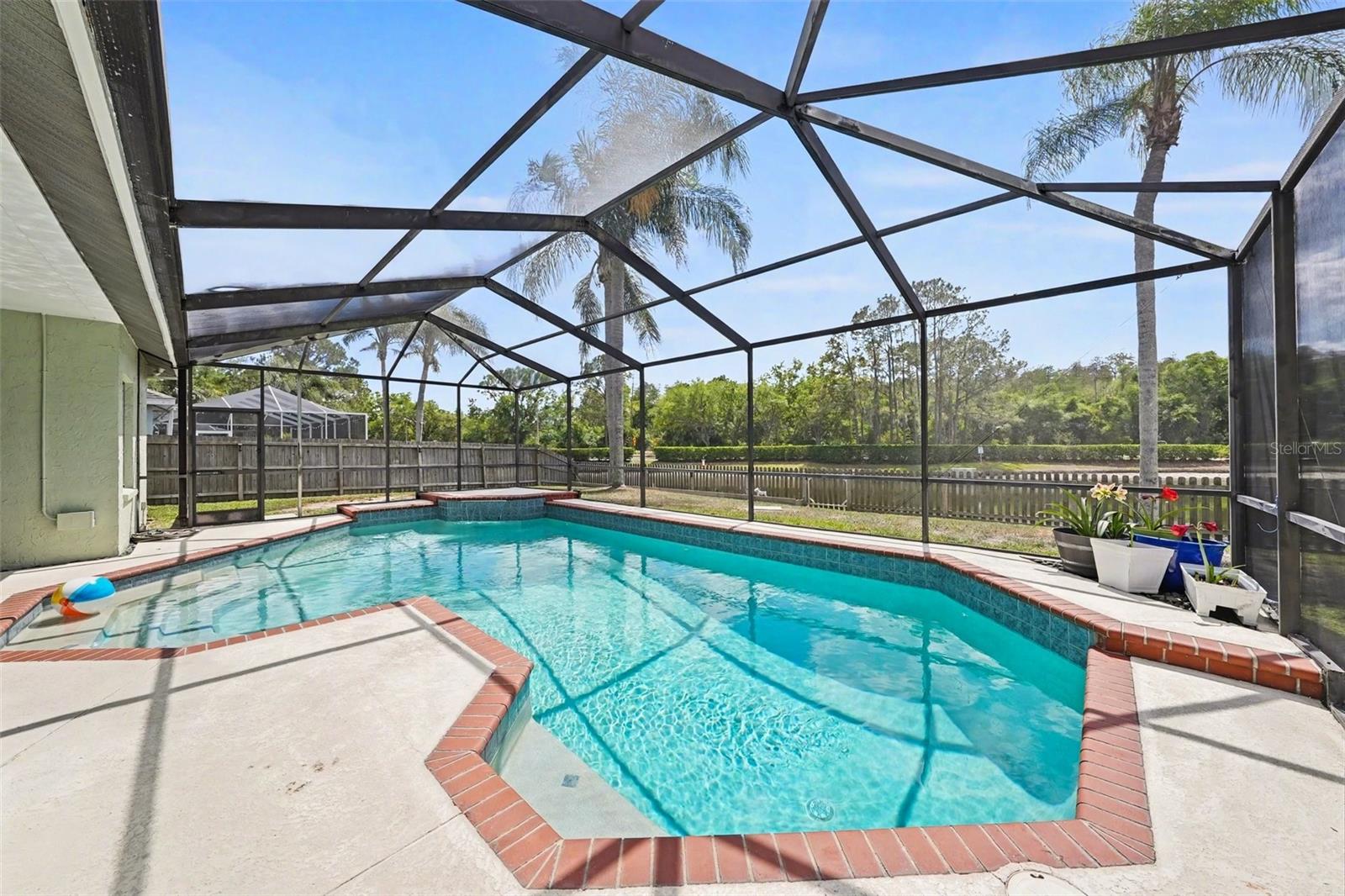 This home comes with a large pool complete with a water feature