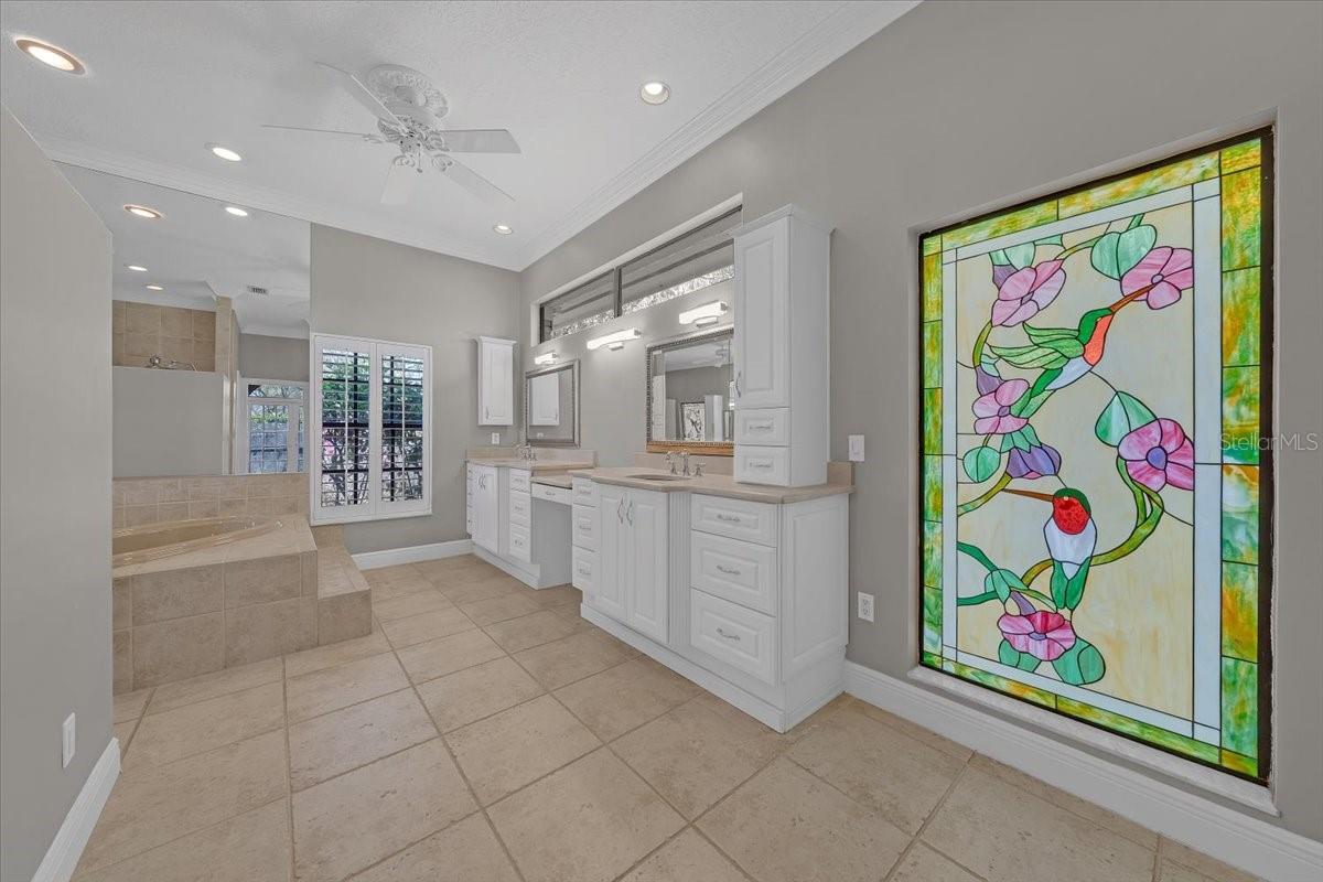 Primary bath with custom window.