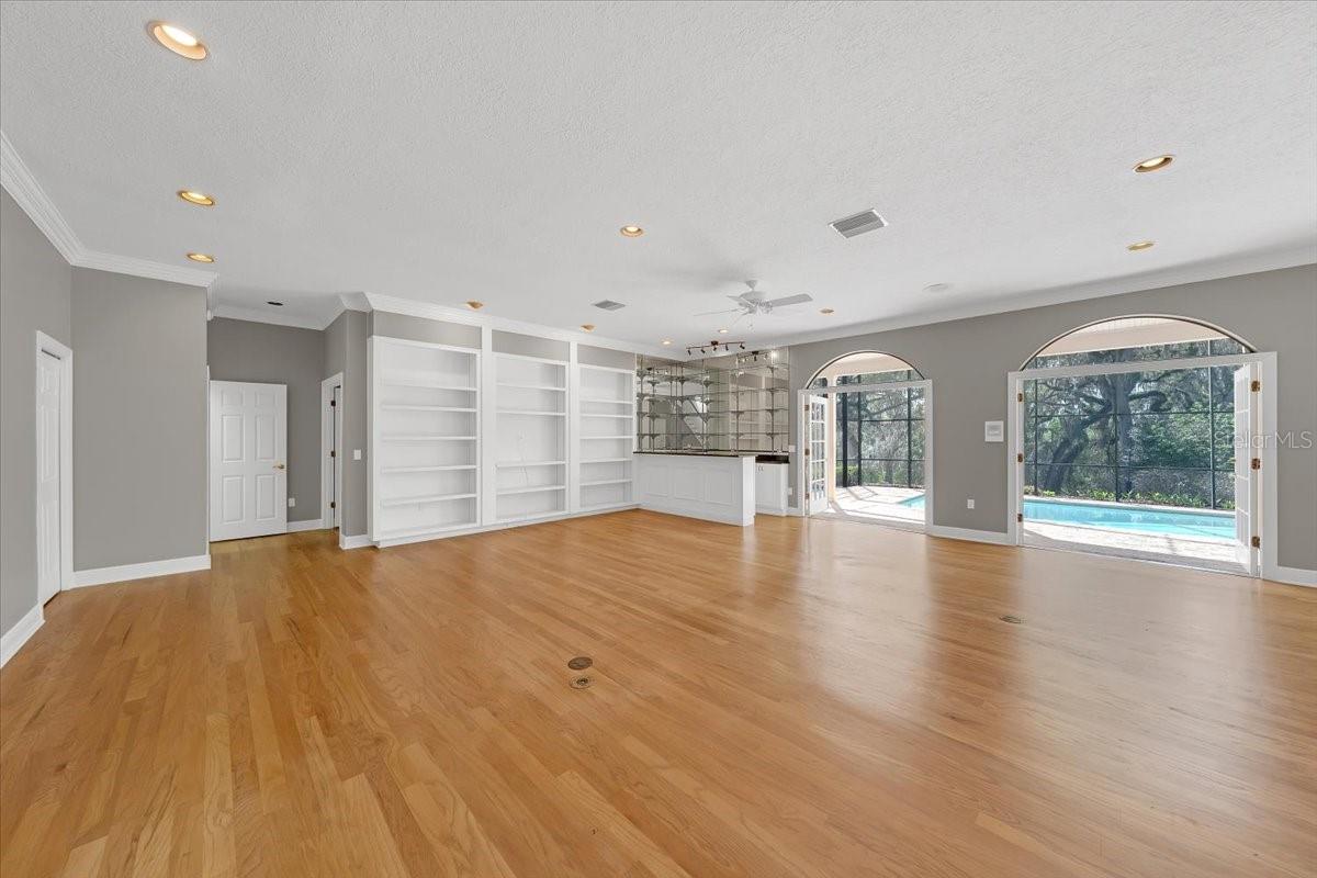 Sunlit great room with built-ins.