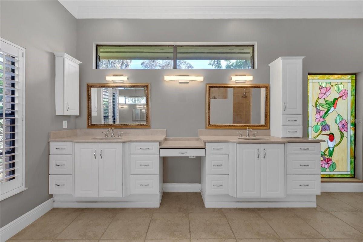 Primary bath with dual vanities.