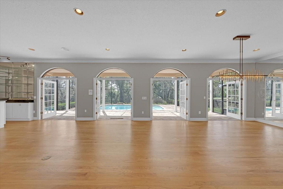 A wall of French doors brings the outside in.