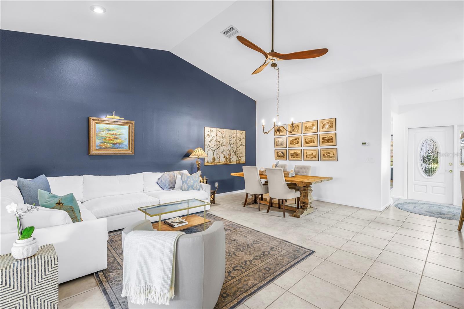 The Living Dining Space is seamless.  As Big a Table as You can Imagine!!  Chandelier in Place