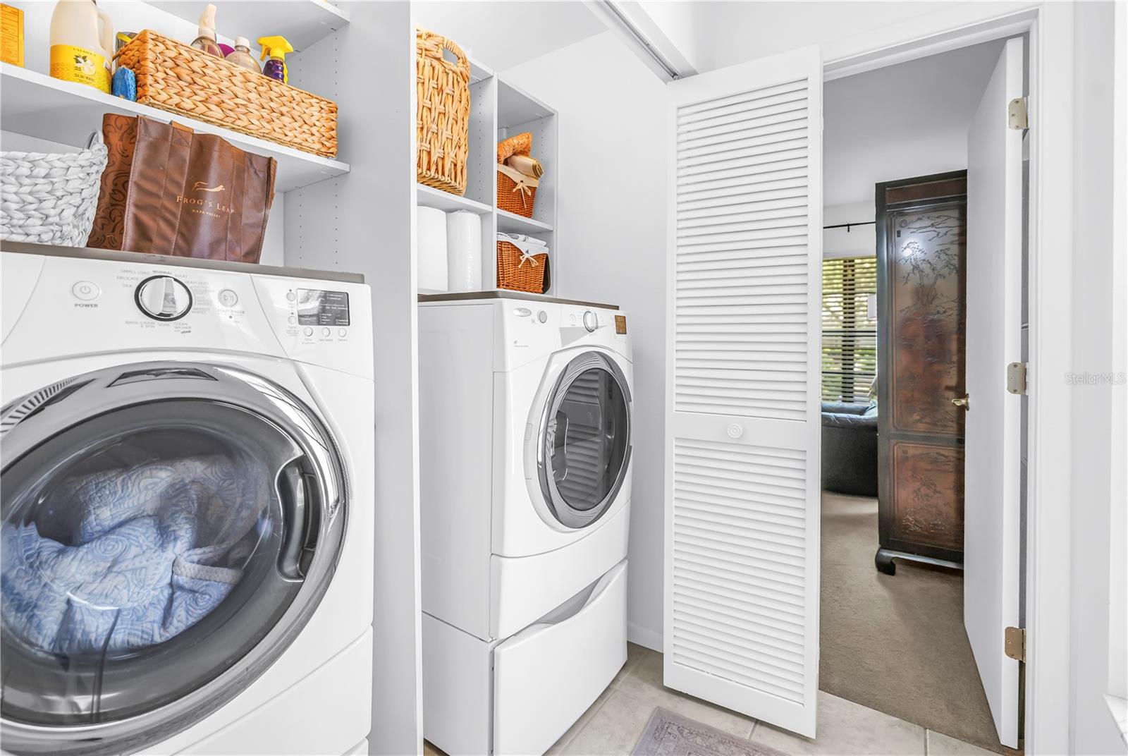 Indoor Laundry in the Hall.  Full Size Machines and Storage