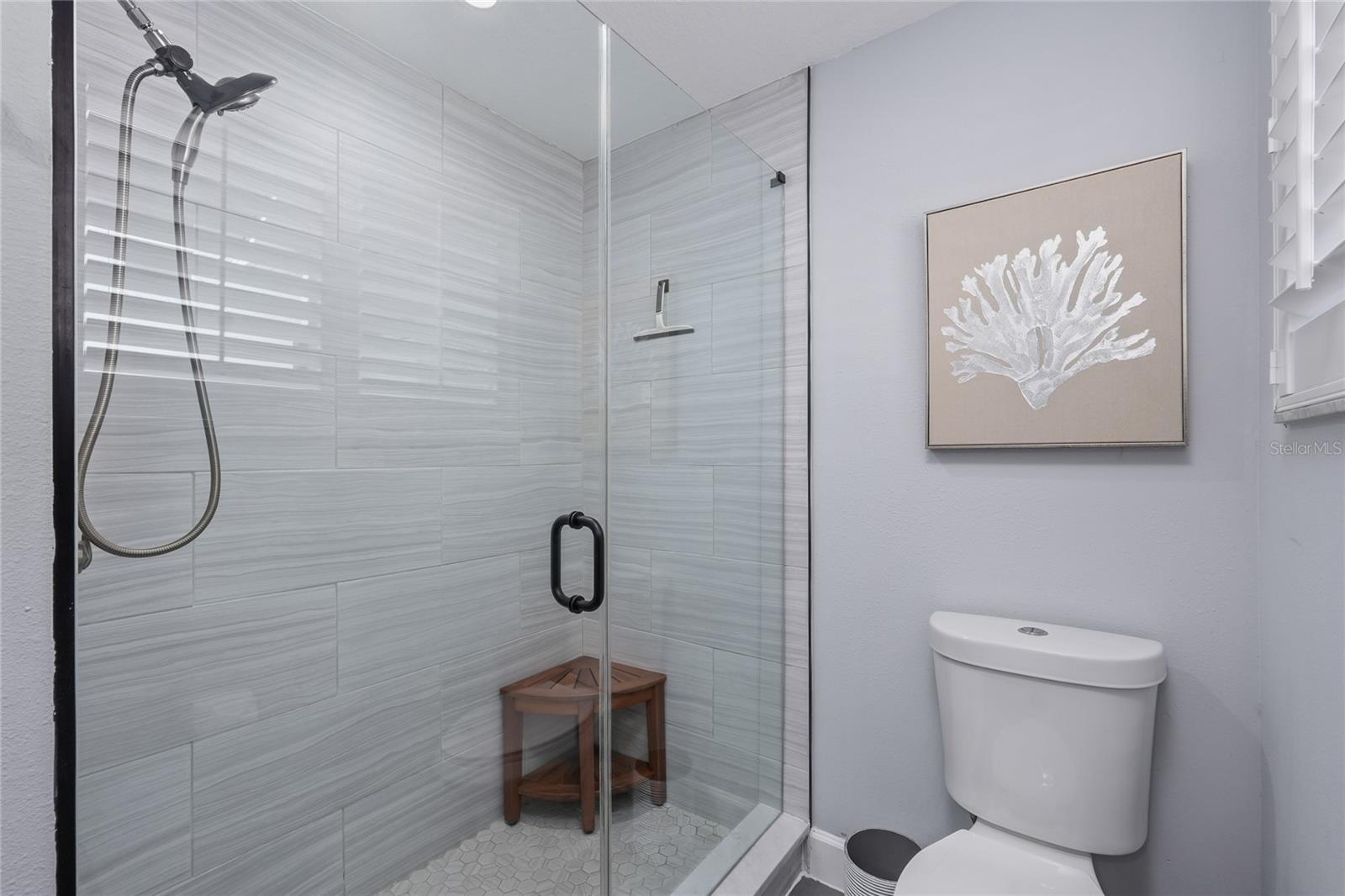 Floor to Ceiling Tile completes this updated shower