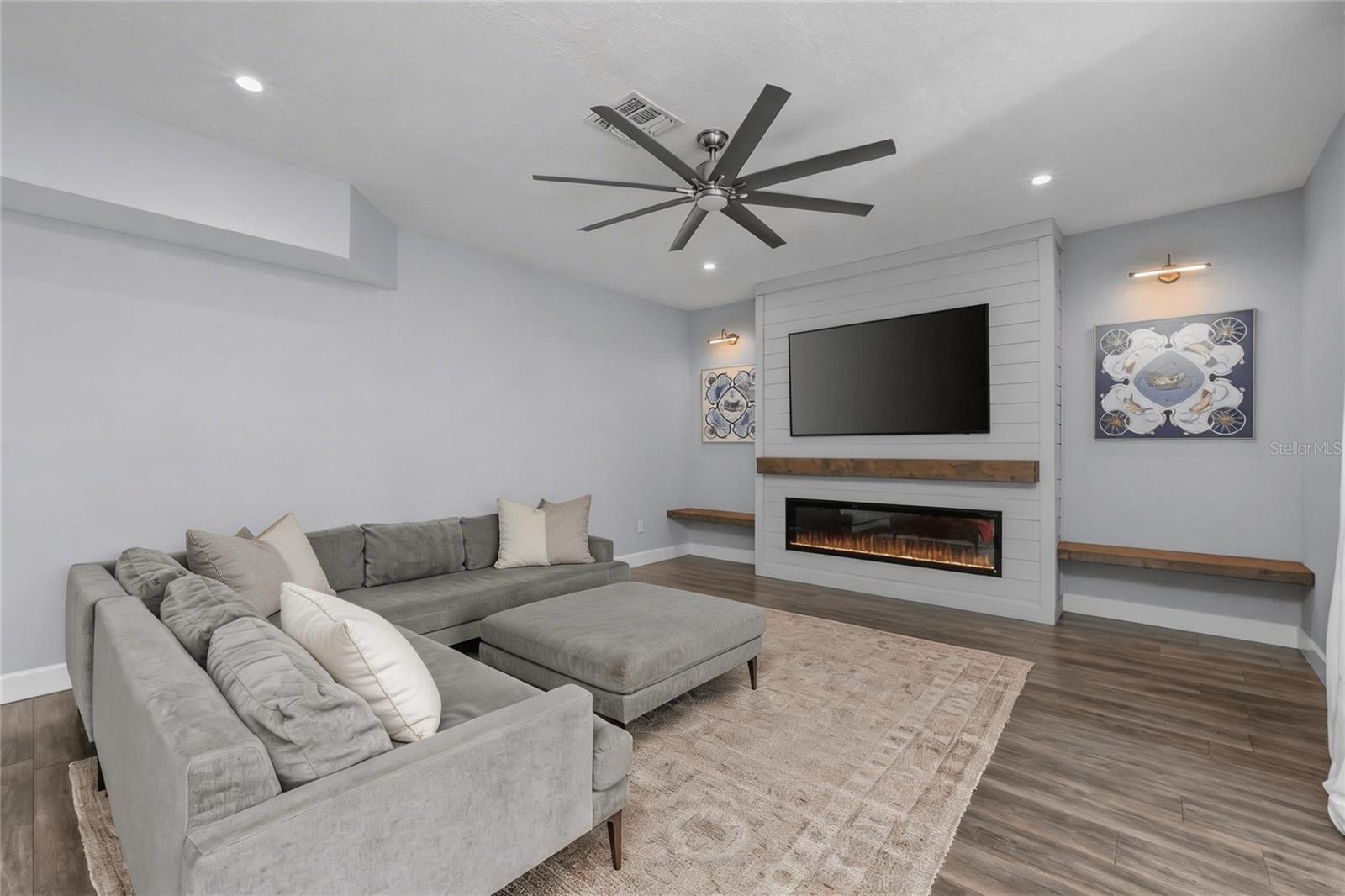 Family Room with accent wall and electric fireplace