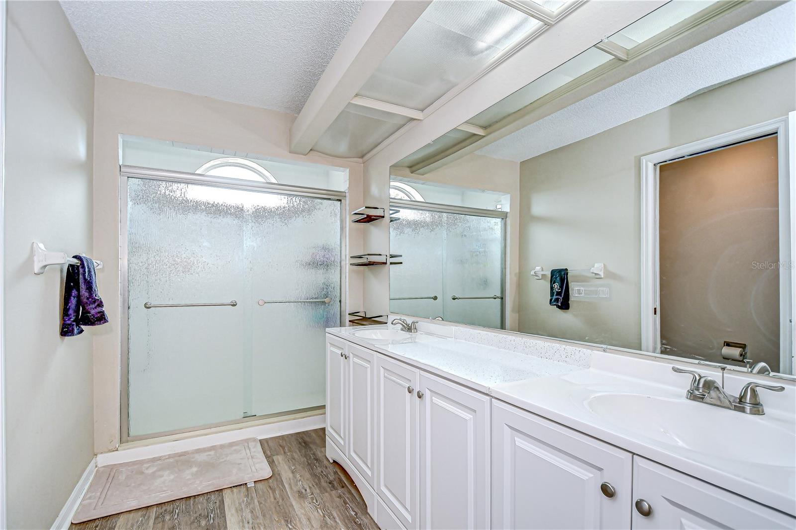 Primary with double sink and shower.