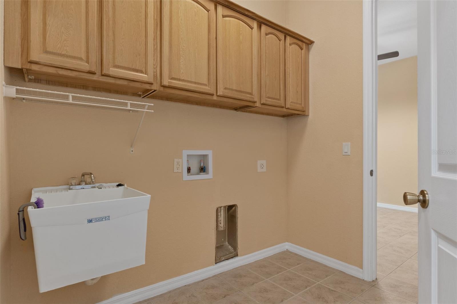 Laundry Room with a Utility Sink and lovely cabinets