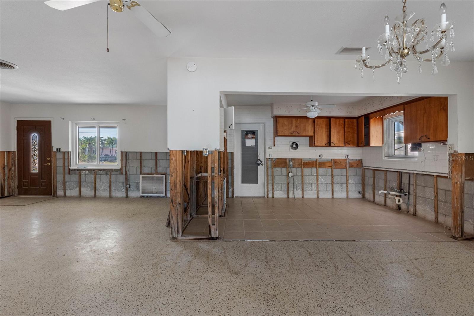 Kitchen opens to living/dining area.