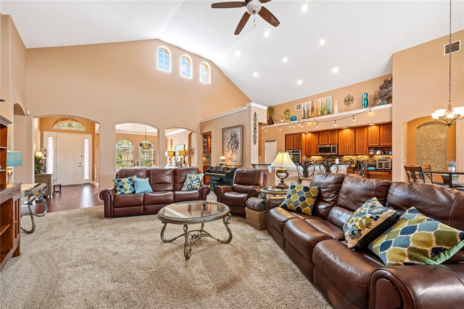 look at this spacious living room with volume ceiling