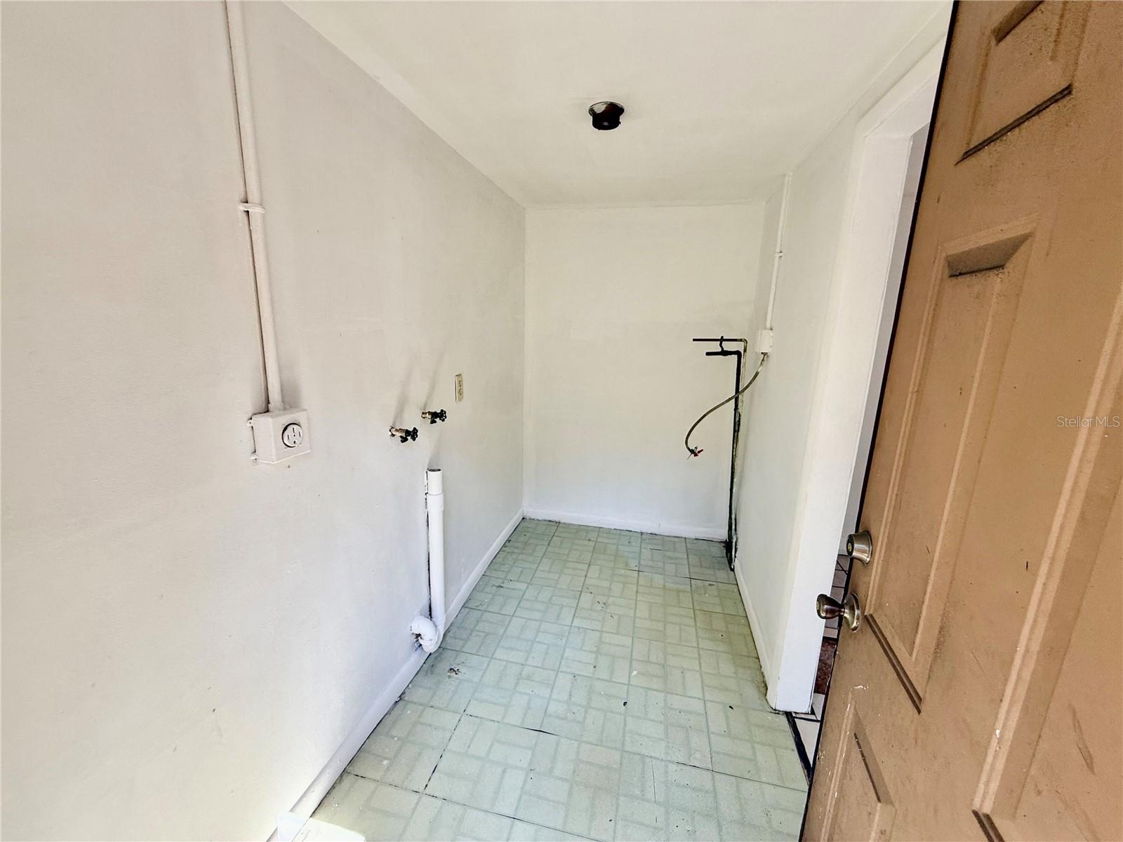 Laundry room offers posibilty for adding a second bath