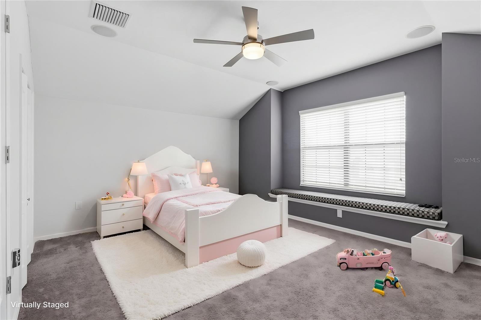 Versatile upstairs bonus room with closet, offering flexibility as a fifth bedroom, home office, media room, or playroom.