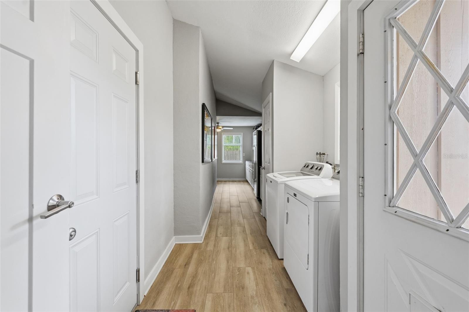 Hallway to the laundry, storage and office
