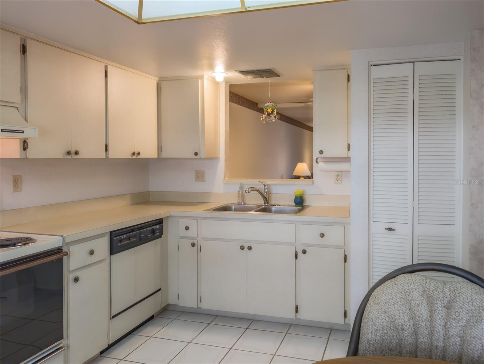 Kitchen has a pass through window to dinning room