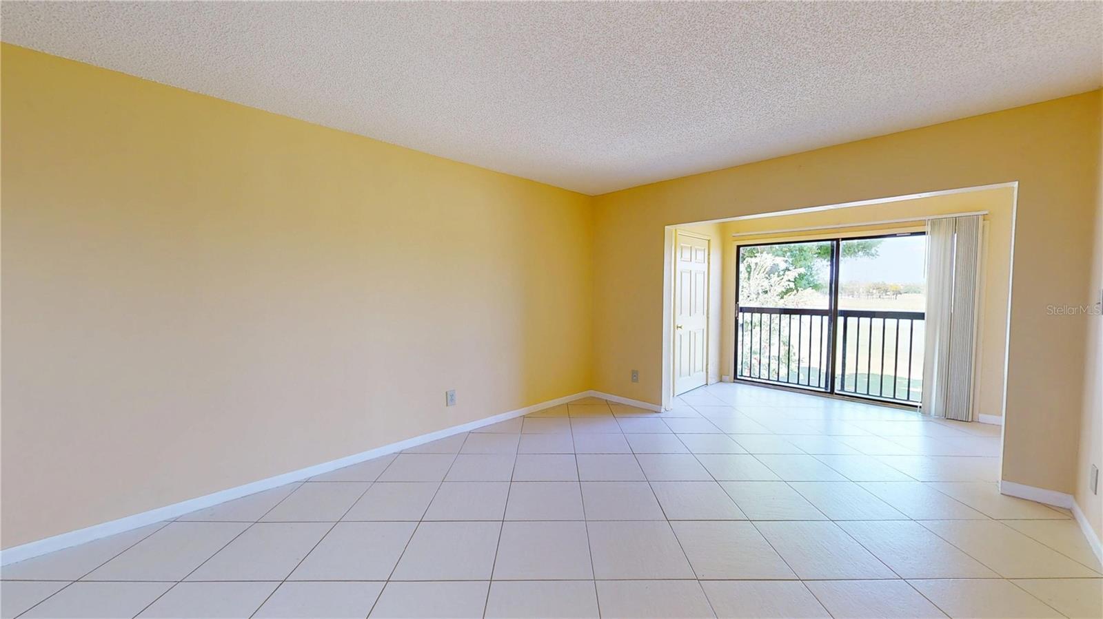 Living Room with Bonus Room overlooking Lake & Golf Course