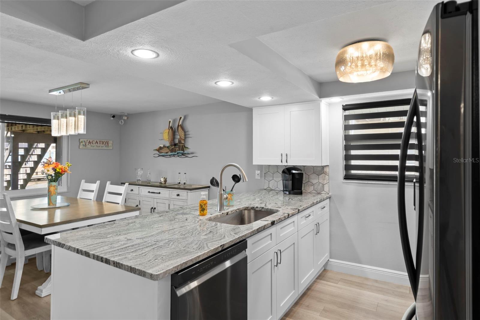 Kitchen with NEW Cabinetry, NEW Granite, NEW Appliances and Custom Blinds