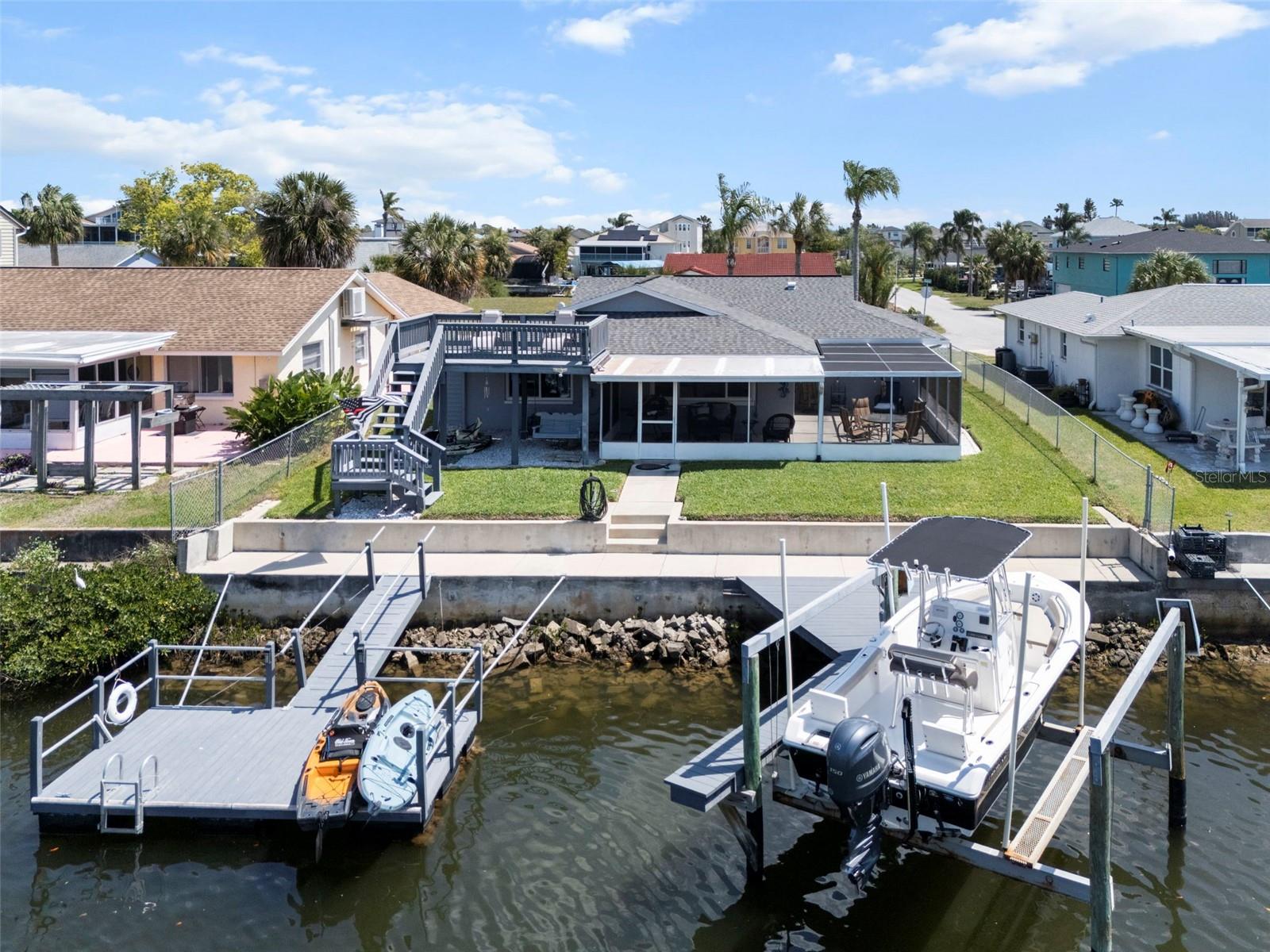 Rear of Home Featuring Floating Dock, Boat Lift and Dock, 60ft Seawall
