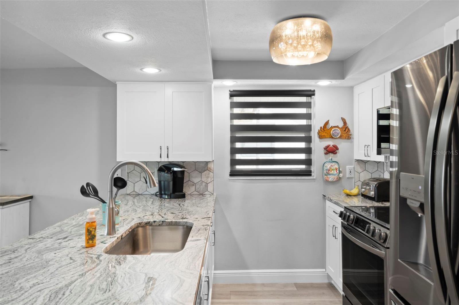 Kitchen with NEW Cabinetry, NEW Granite, NEW Appliances and Custom Blinds