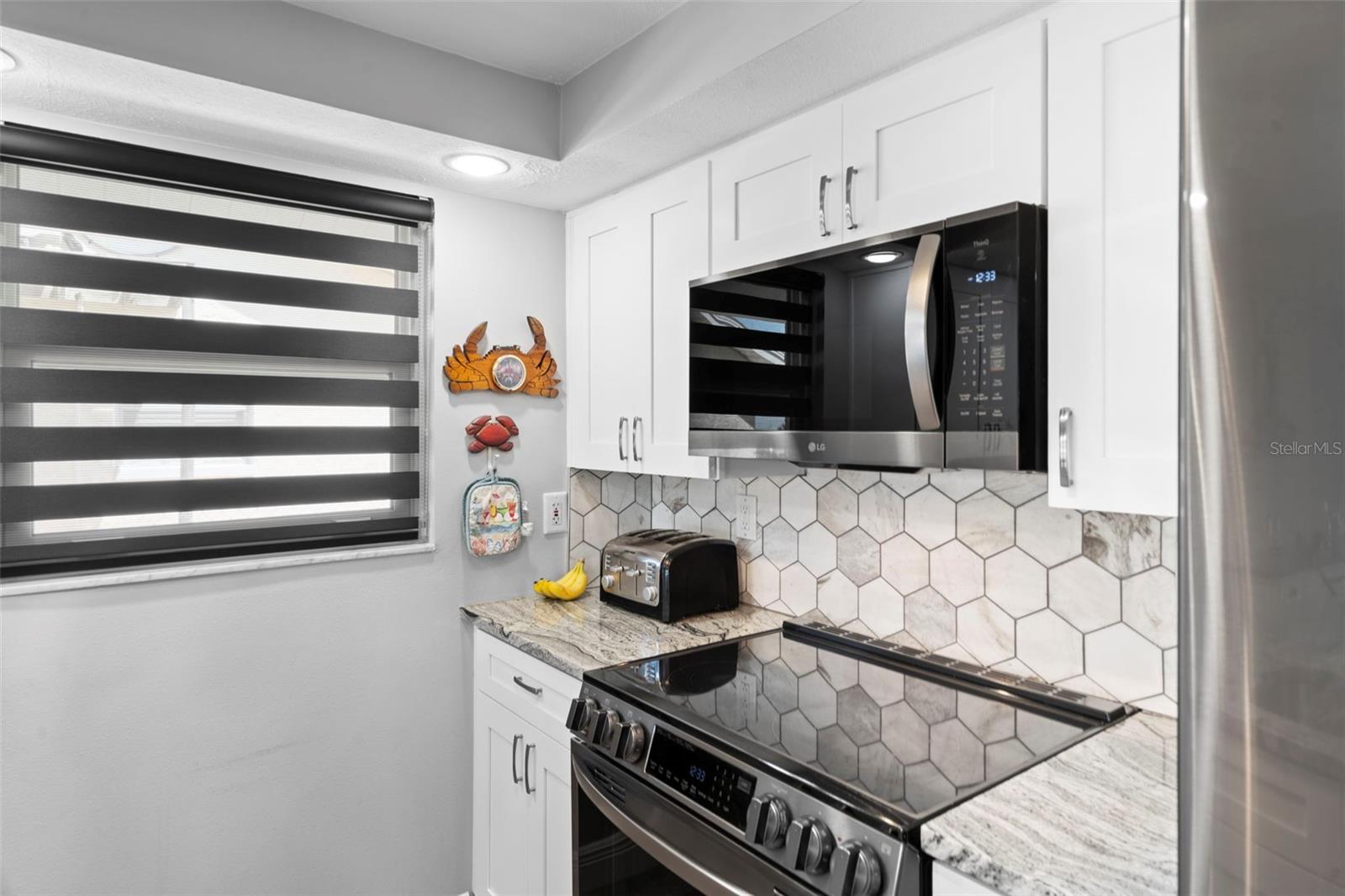 Kitchen with NEW Cabinetry, NEW Granite, NEW Appliances and Custom Blinds