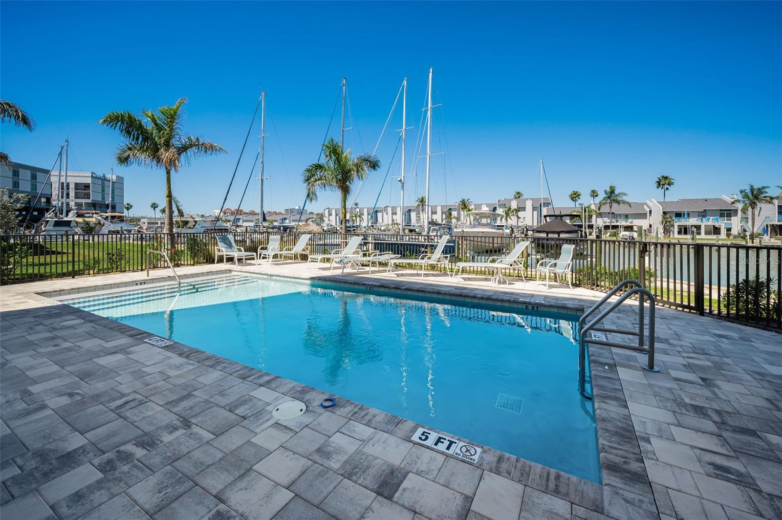 Shimmering, resort-style inground heated pool on the water!