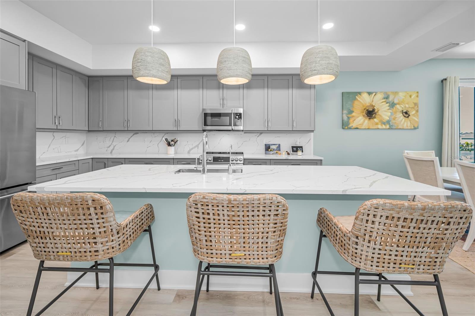 A luxe, contemporary culinary space with a generous center island