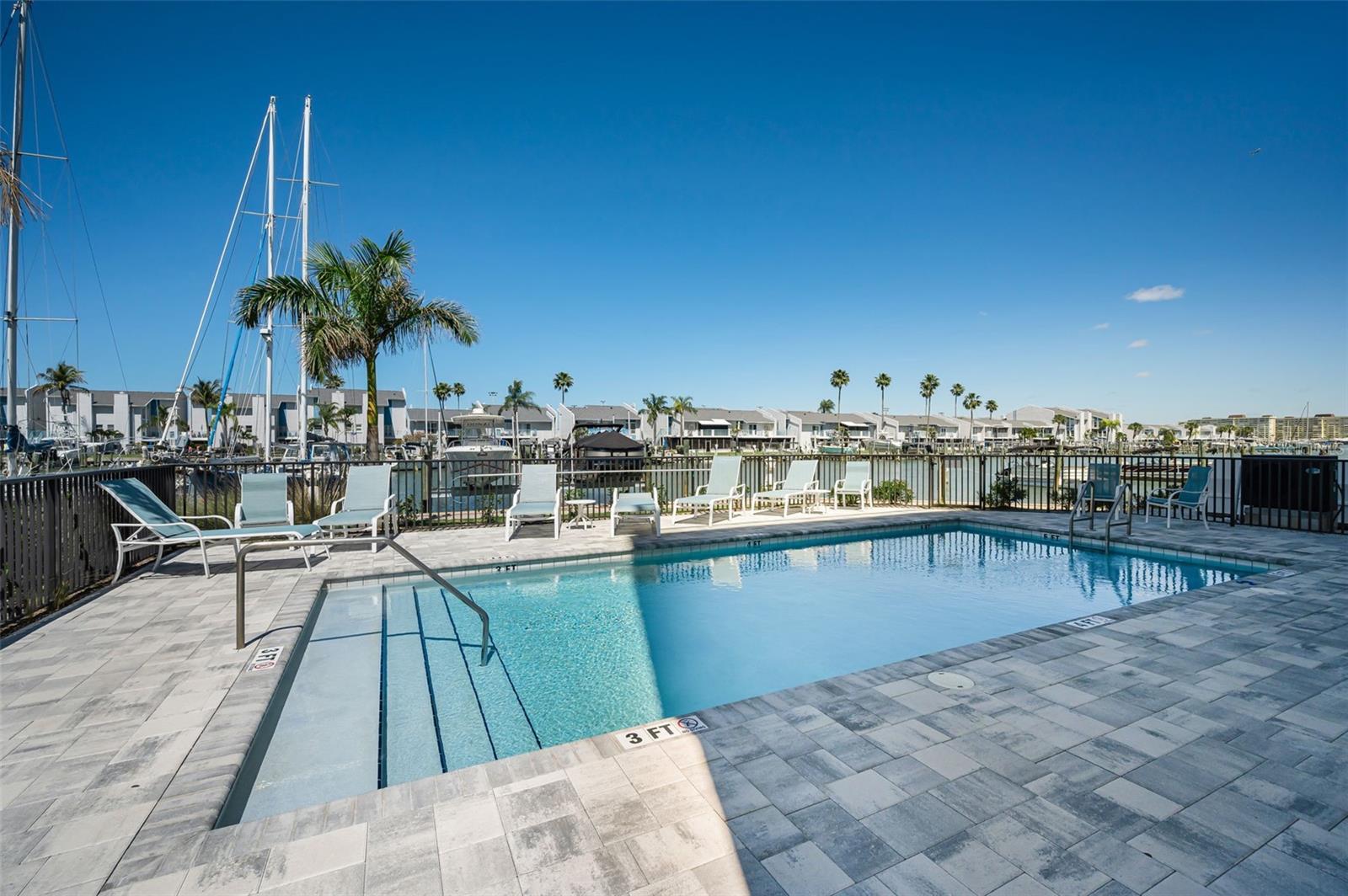 Crystal-clear, resort-inspired heated inground pool on the waterfront!