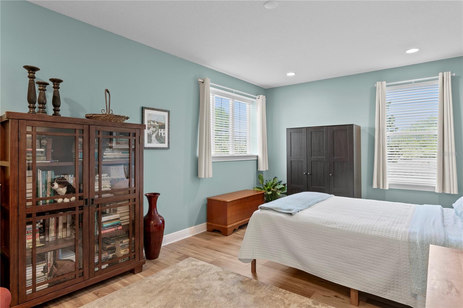 This bedroom is large enough to serve as both a bedroom as well as a bonus area