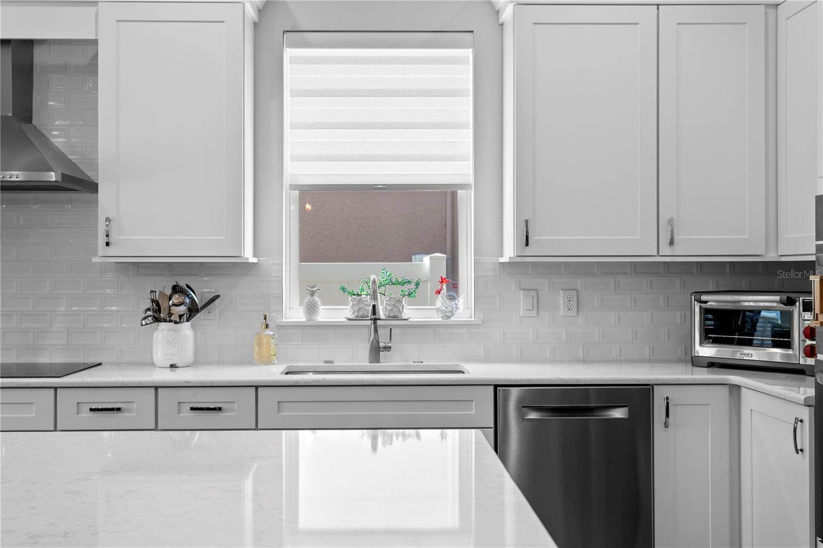 A beautiful window above the sink makes dishwashing pleasant