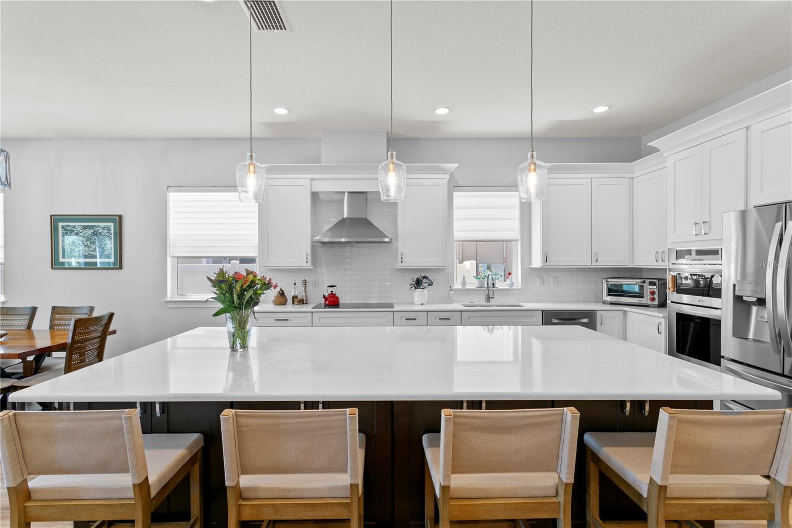 The oversized center island provides bar seating and loads of extra storage