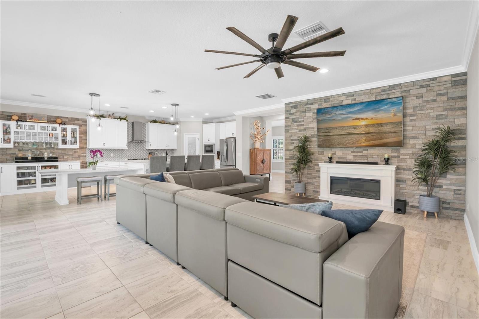 LIVING ROOM WITH ACCENT WALL & FIREPLACE