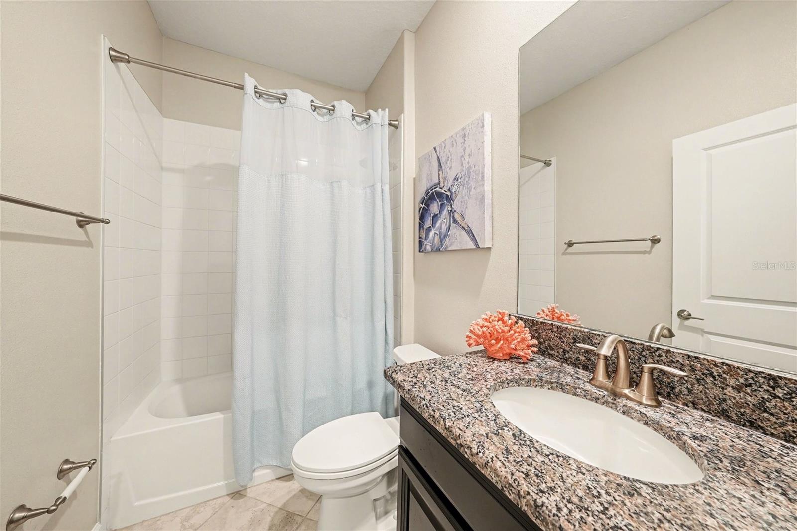 3rd Bath features granite counters and a tub with shower.