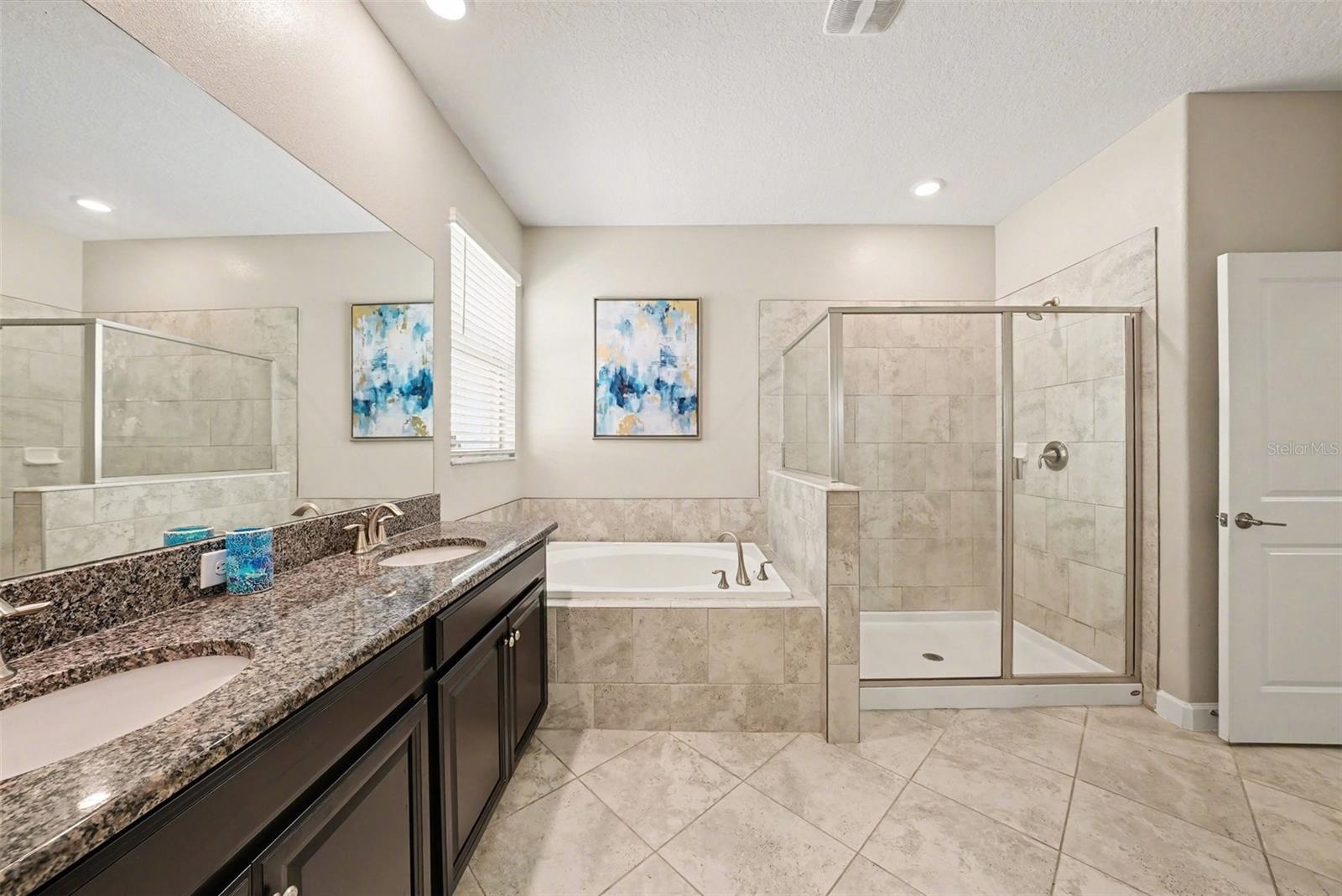 Primary En Suite with garden tub and large shower.