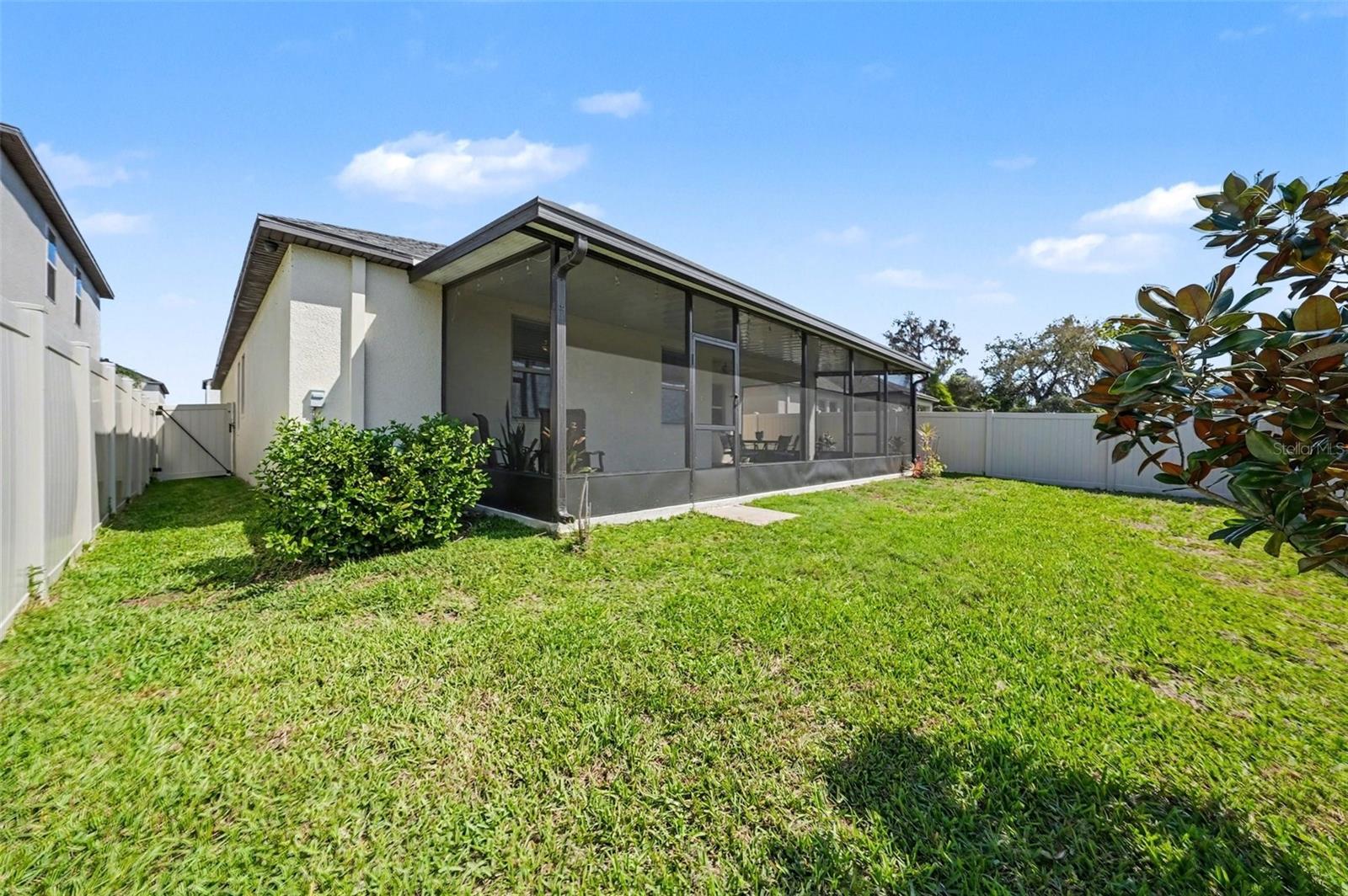 The beautiful back yard is private and fully fenced.