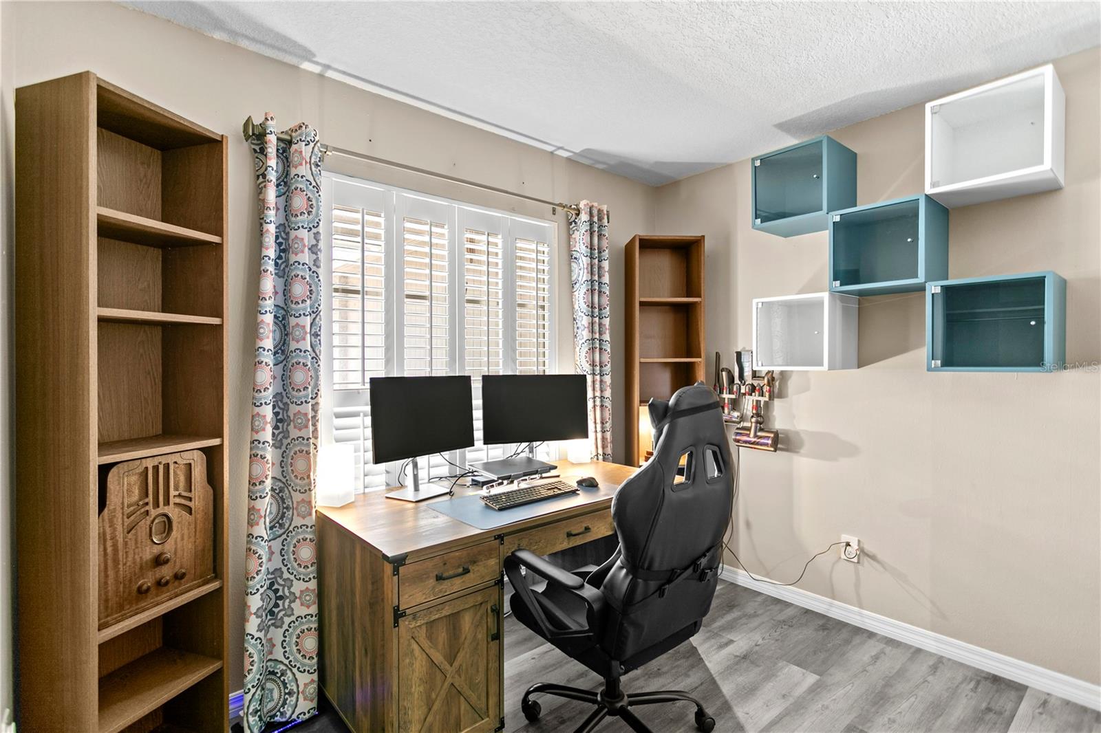 Bedroom #3 features a ceiling fan and luxury vinyl flooring